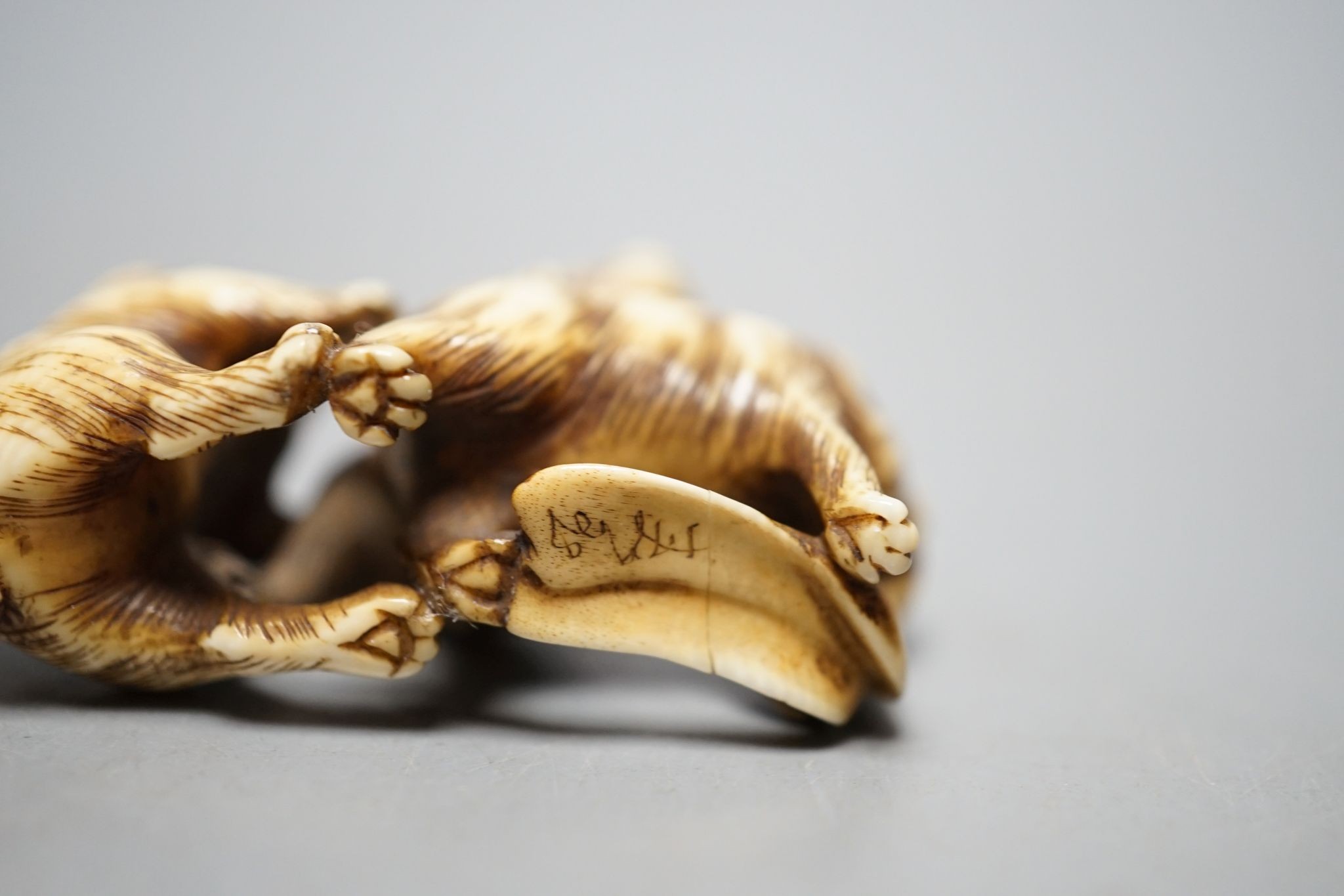 A Japanese ivory netsuke monkey group, 19th century, signed, 5cm